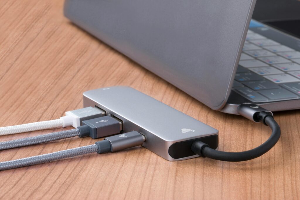 USB-C hub connected to a laptop with multiple ports for remote workers