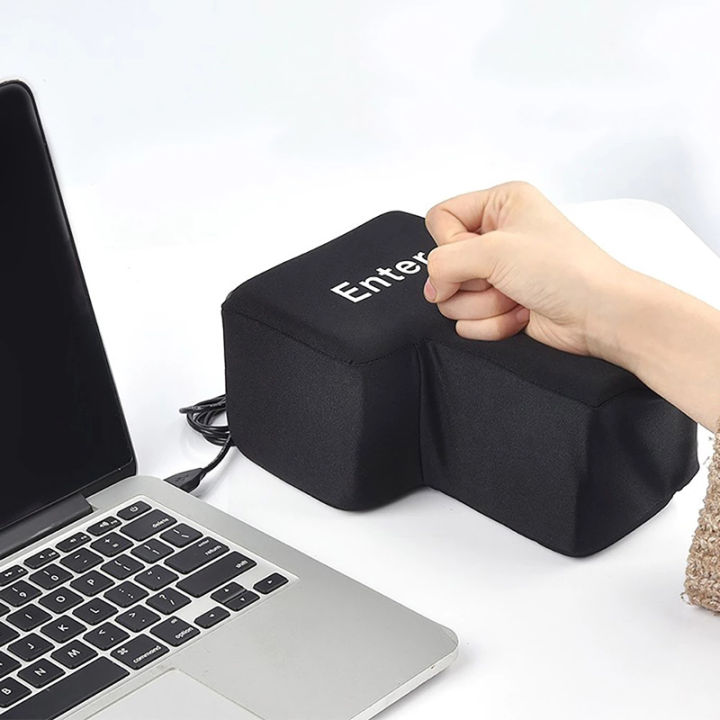 Mini desktop punching bag with suction base on an office desk