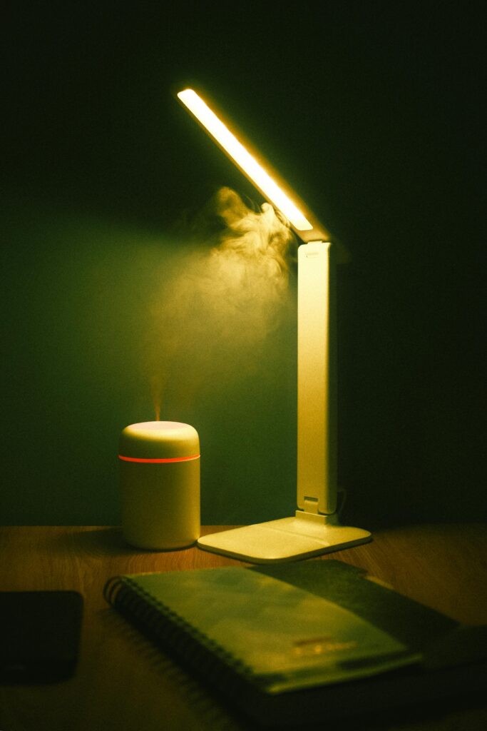 Modern LED desk lamp with USB charging port on a study table
